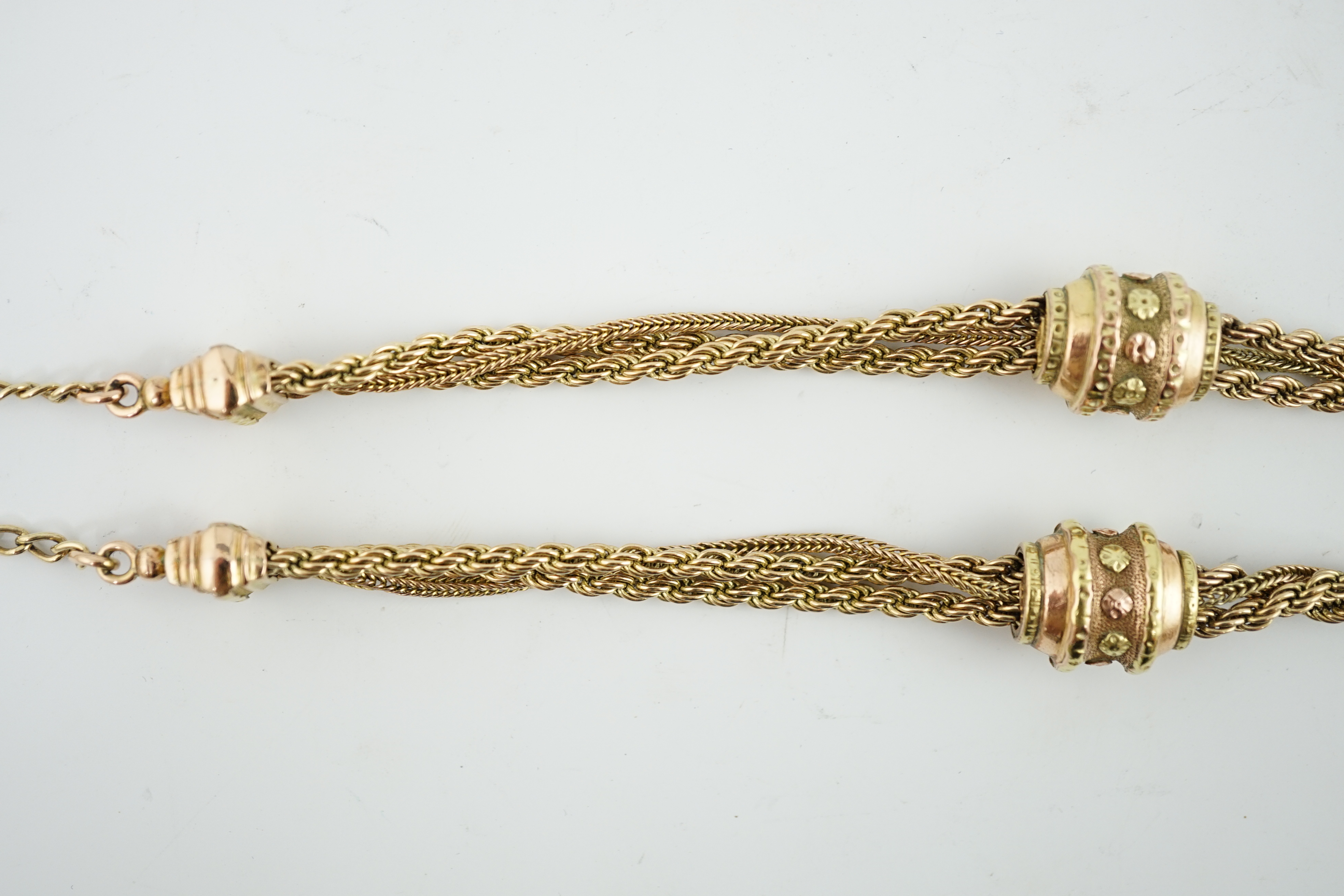 A Victorian two colour gold triple strand Albertina